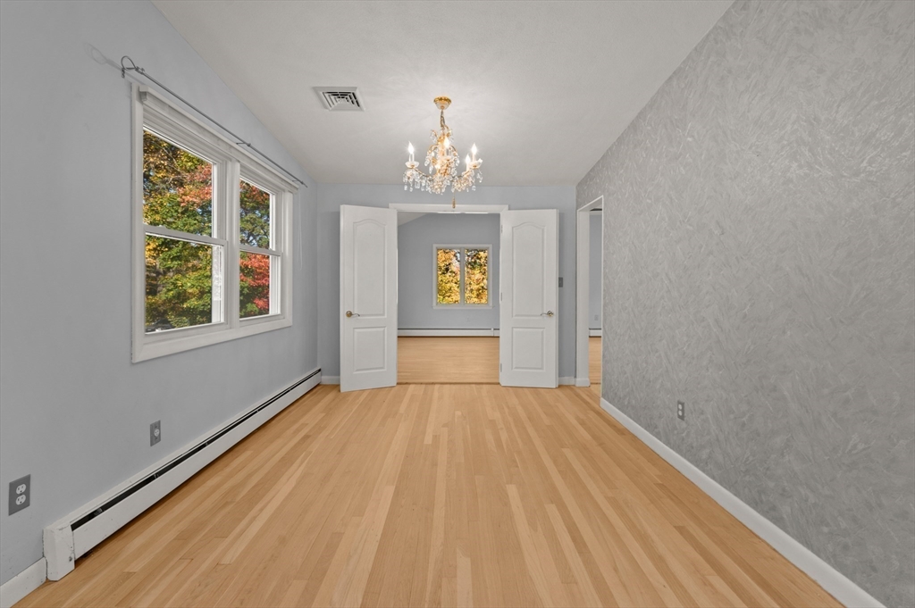 10 Strawberry Hill Road Andover, MA 01810 - Photo 10 of 41 a view of an empty room with a window
