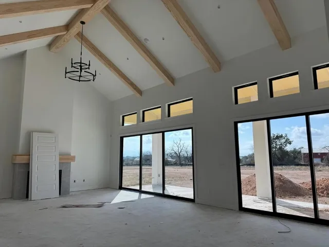 a large kitchen with granite countertop a sink a counter space and stainless steel appliances