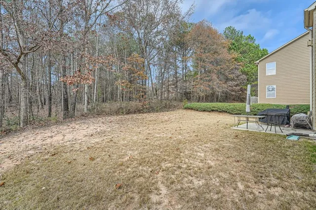 a view of backyard with outdoor space