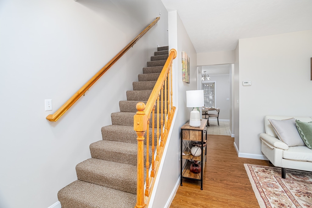 104 Lake Street, Unit 104 Gardner, MA 01440 - Photo 12 of 30 a view of entryway and hall with wooden floor