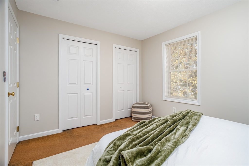 104 Lake Street, Unit 104 Gardner, MA 01440 - Photo 20 of 30 a bedroom with a bed and a window