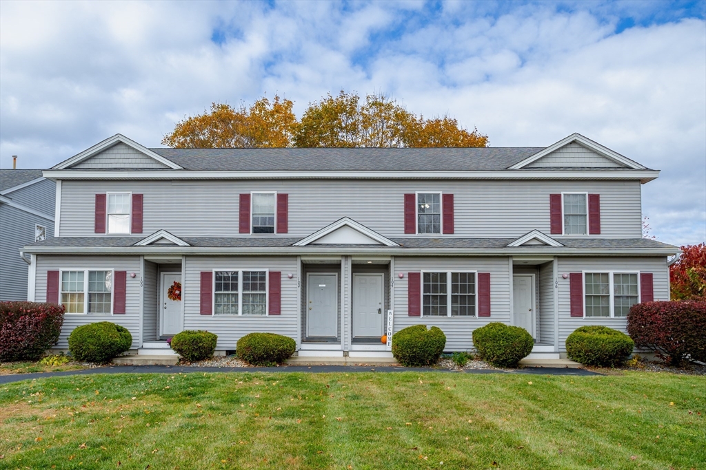 104 Lake Street, Unit 104 Gardner, MA 01440 - Photo 2 of 30 front view of a brick house with a yard