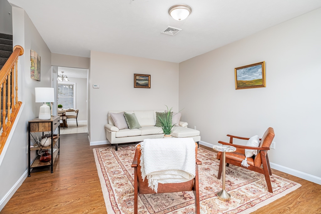 104 Lake Street, Unit 104 Gardner, MA 01440 - Photo 3 of 30 a living room with furniture and a wooden floor