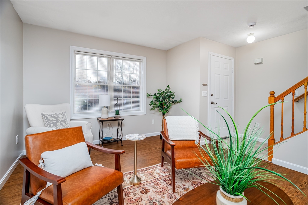 104 Lake Street, Unit 104 Gardner, MA 01440 - Photo 5 of 30 a view of a livingroom with furniture and a potted plant