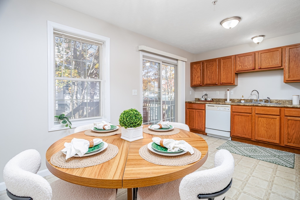 104 Lake Street, Unit 104 Gardner, MA 01440 - Photo 7 of 30 a kitchen with furniture and a stove