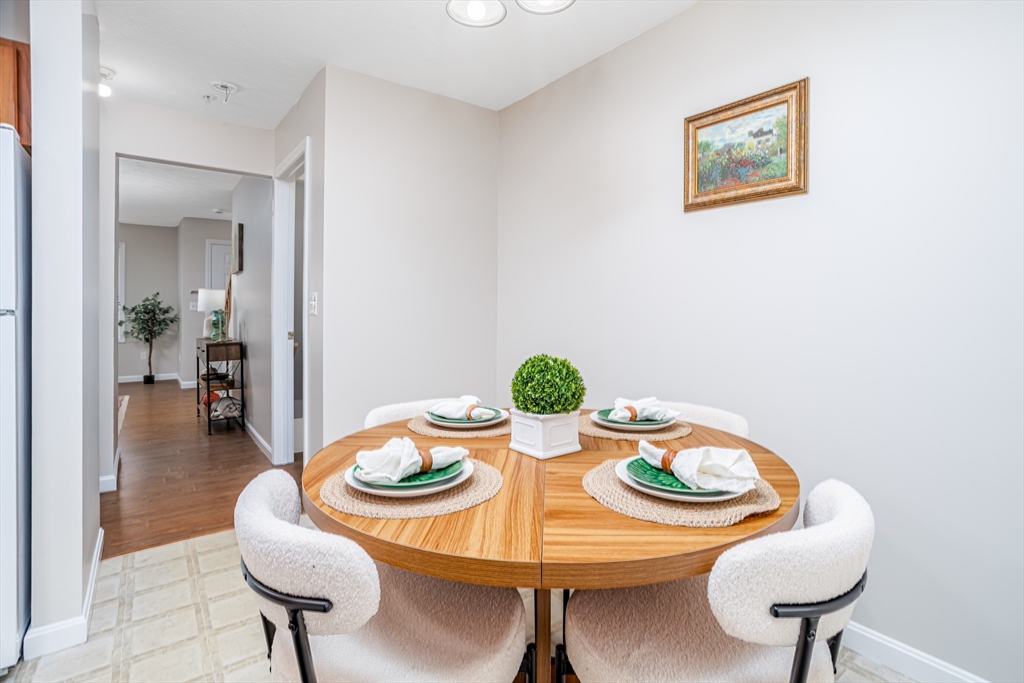 104 Lake Street, Unit 104 Gardner, MA 01440 - Photo 9 of 30 a view of a dining room with furniture
