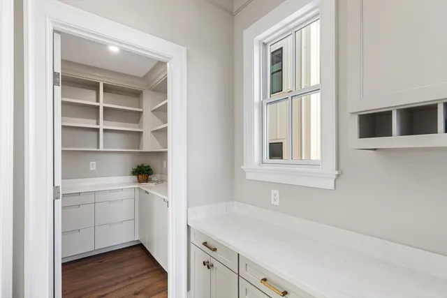 a view of a kitchen cabinets and a window