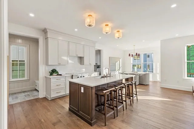 an open kitchen with a table and chairs in it