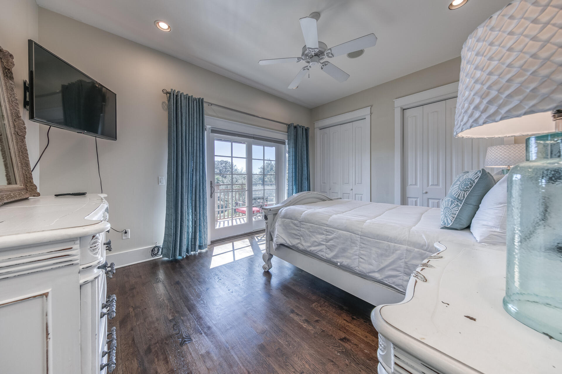 5231 East County Highway 30A, Unit E Santa Rosa Beach, FL 32459 - Photo 13 of 41 a bedroom with a bed and a flat screen tv