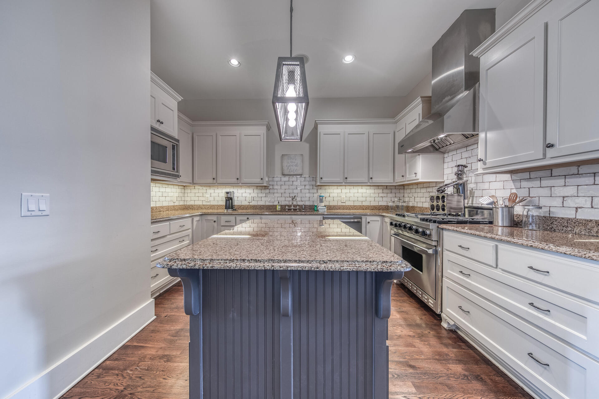 5231 East County Highway 30A, Unit E Santa Rosa Beach, FL 32459 - Photo 14 of 41 a kitchen with stainless steel appliances granite countertop a sink stove and cabinets