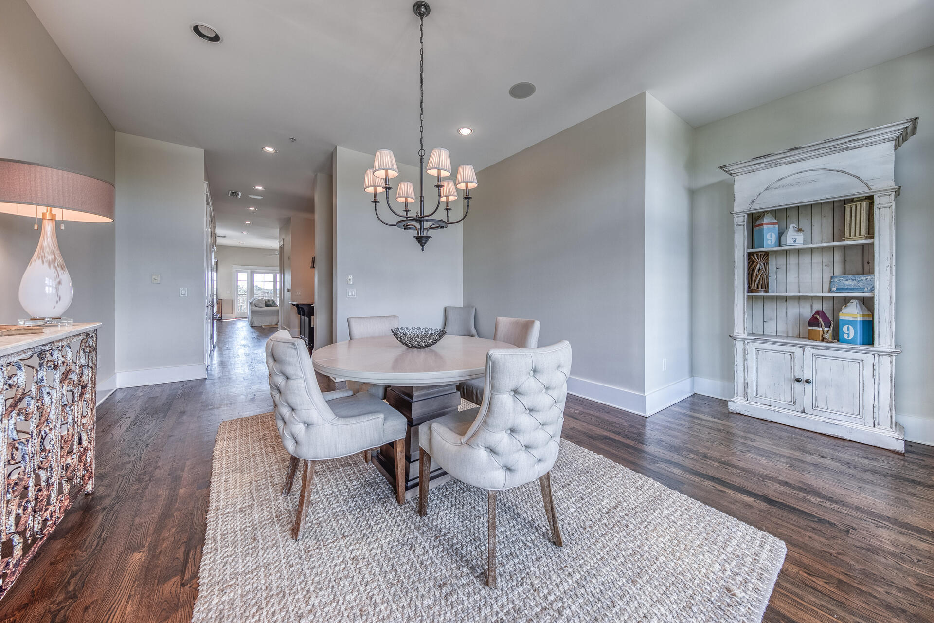 5231 East County Highway 30A, Unit E Santa Rosa Beach, FL 32459 - Photo 16 of 41 a view of a dining room with furniture and wooden floor
