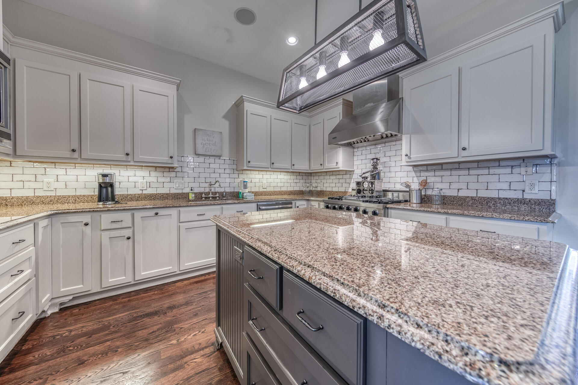 5231 East County Highway 30A, Unit E Santa Rosa Beach, FL 32459 - Photo 20 of 41 a kitchen with stainless steel appliances granite countertop a sink a stove counter space and cabinets