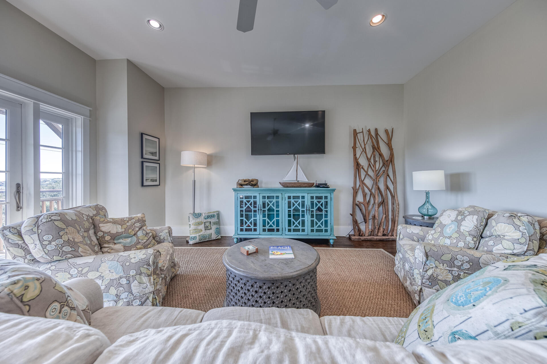 5231 East County Highway 30A, Unit E Santa Rosa Beach, FL 32459 - Photo 23 of 41 a living room with furniture and a flat screen tv