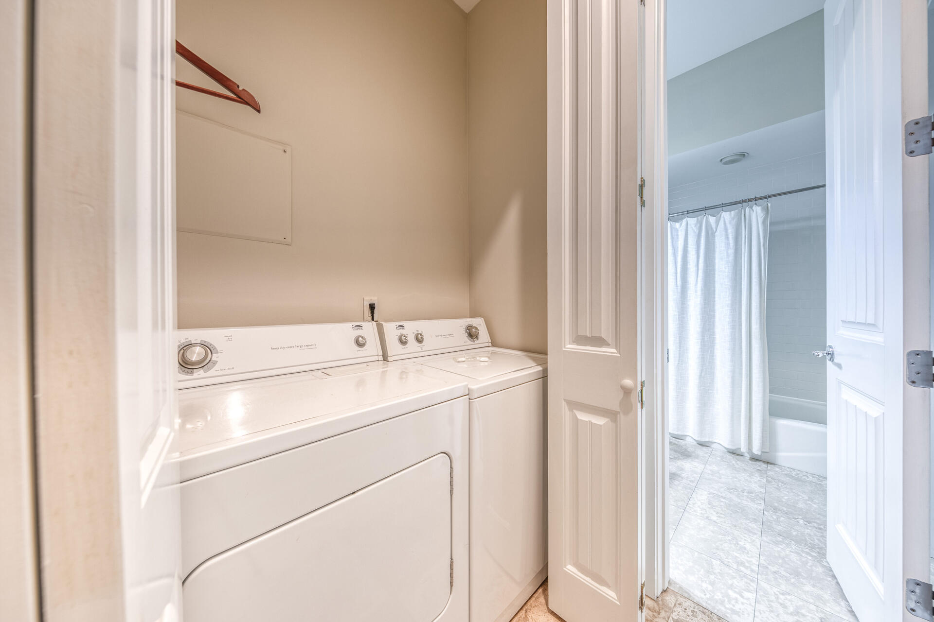 5231 East County Highway 30A, Unit E Santa Rosa Beach, FL 32459 - Photo 27 of 41 a utility room with dryer and washer