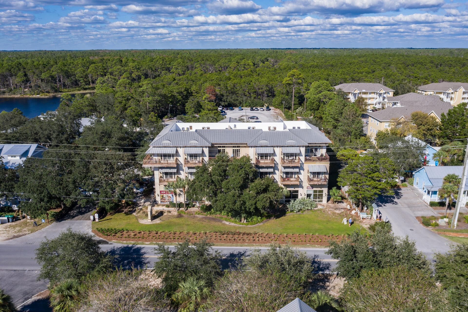 5231 East County Highway 30A, Unit E Santa Rosa Beach, FL 32459 - Photo 38 of 41 an aerial view of a house with a garden and lake view