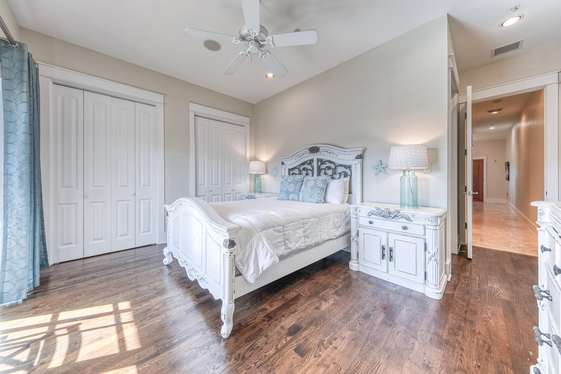 5231 East County Highway 30A, Unit E Santa Rosa Beach, FL 32459 - Photo 10 of 41 a bedroom with a bed and a chandelier