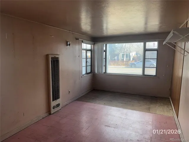 an empty room with closet area