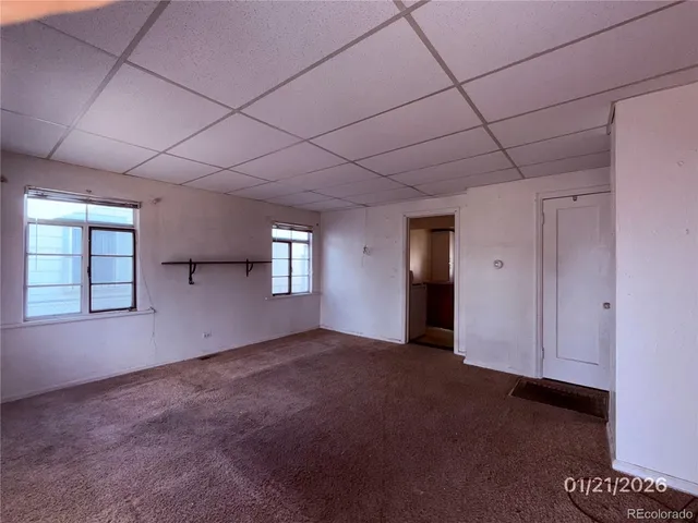 a view of empty room with windows