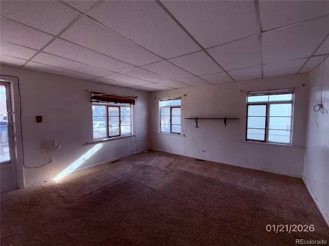 a view of empty room with windows