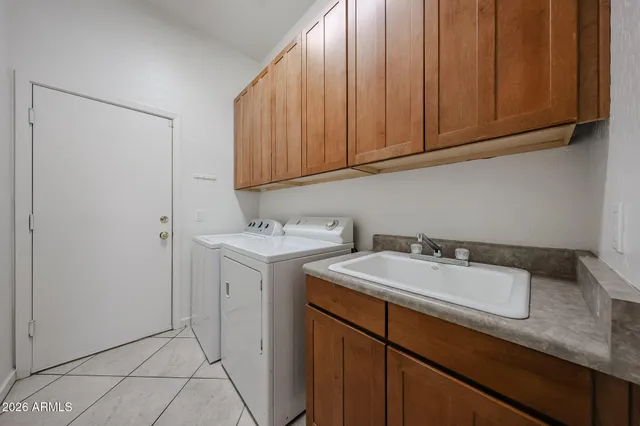 a bathroom with a granite countertop sink mirror and a
