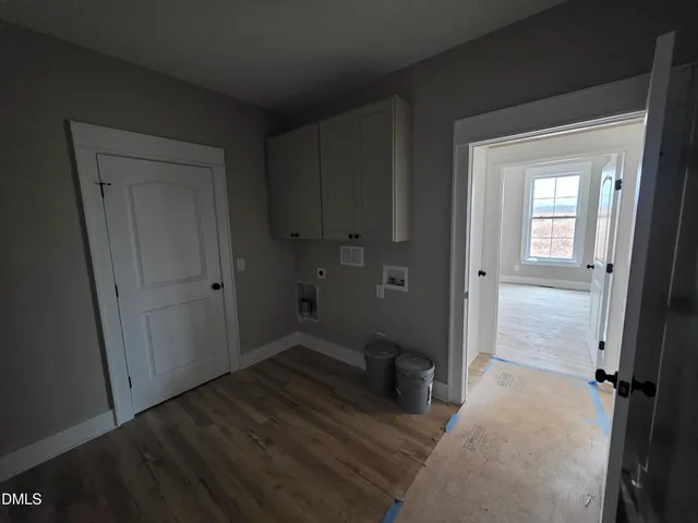 wooden floor and closet in a bathroom