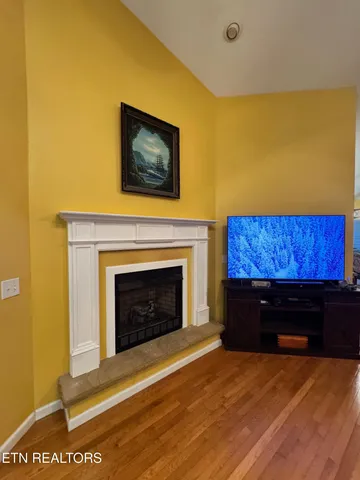 a kitchen with stainless steel appliances granite countertop a refrigerator a stove top oven and sink