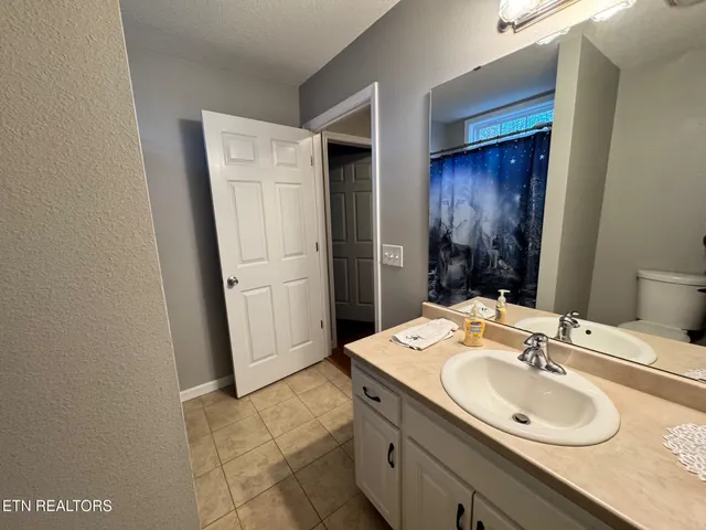 a bed room with a bed and a tv