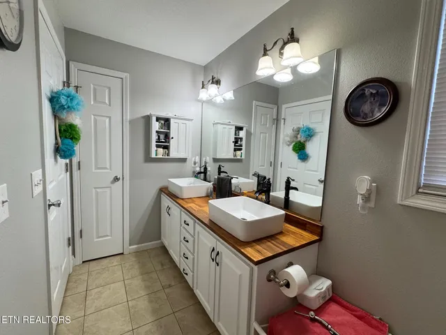 a bathroom with a tub and a shower