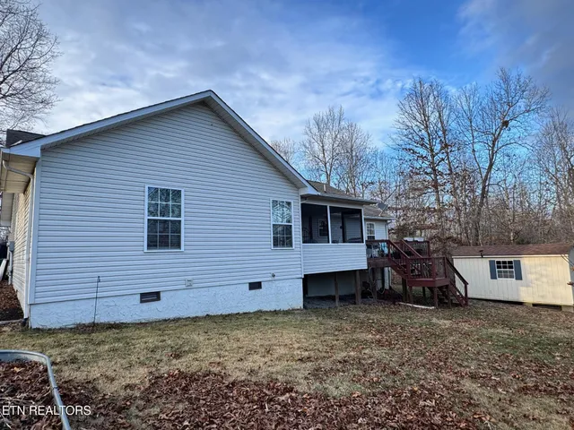 a view of a chair and table in the balcony