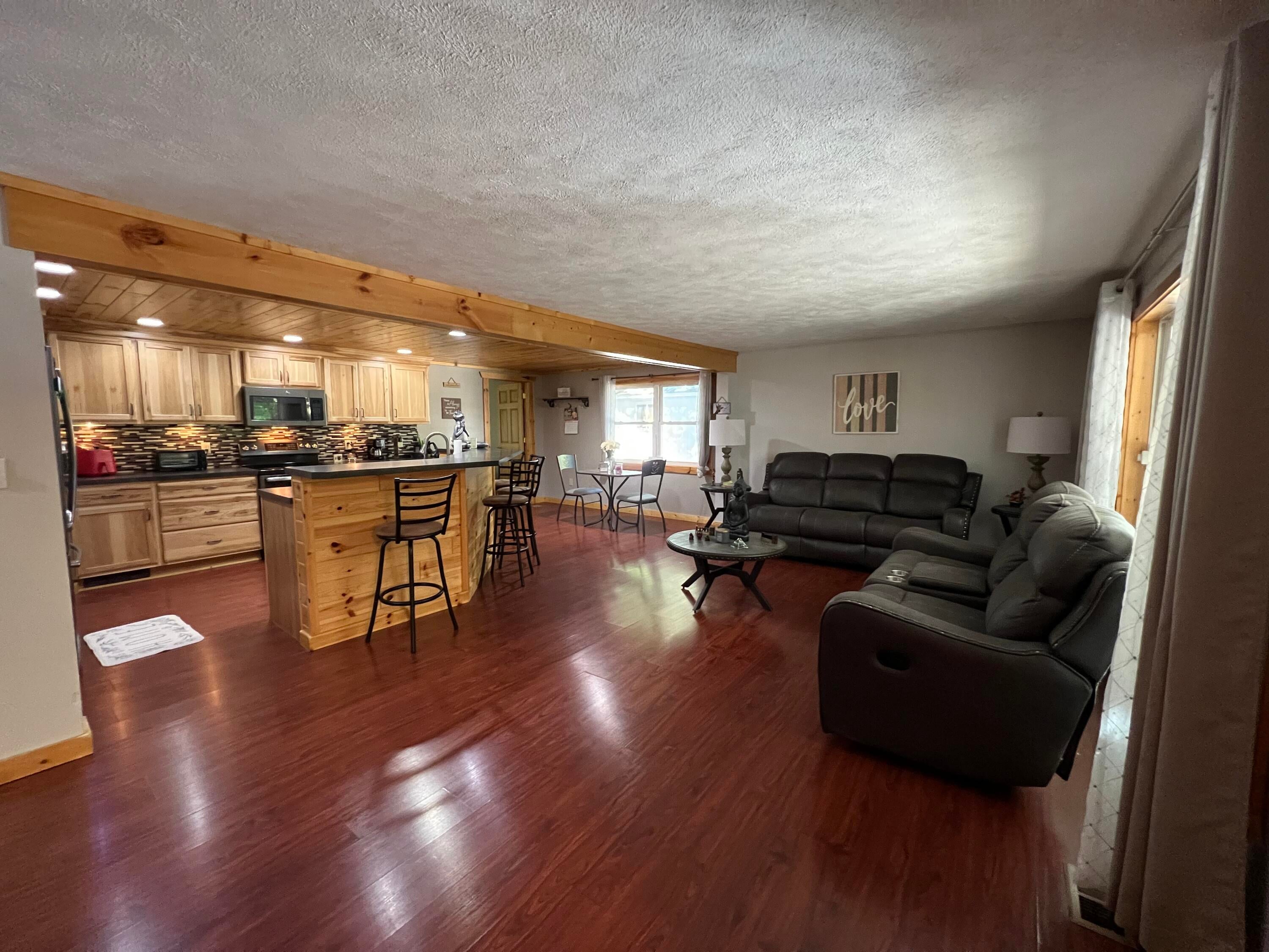 1941 High Road Roscommon, MI 48653 - Photo 5 of 54 living room and kitchen area 1