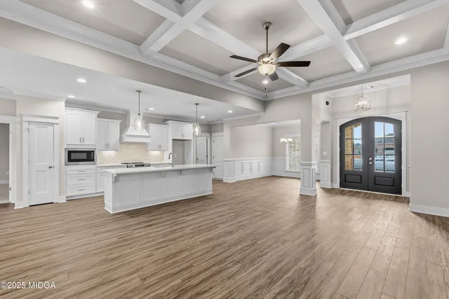 a white bath tub sitting next to a shower