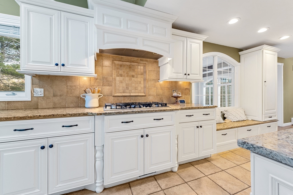 63 Farm Hill Road North Attleboro, MA 02760 - Photo 11 of 42 a kitchen with granite countertop white cabinets and white appliances