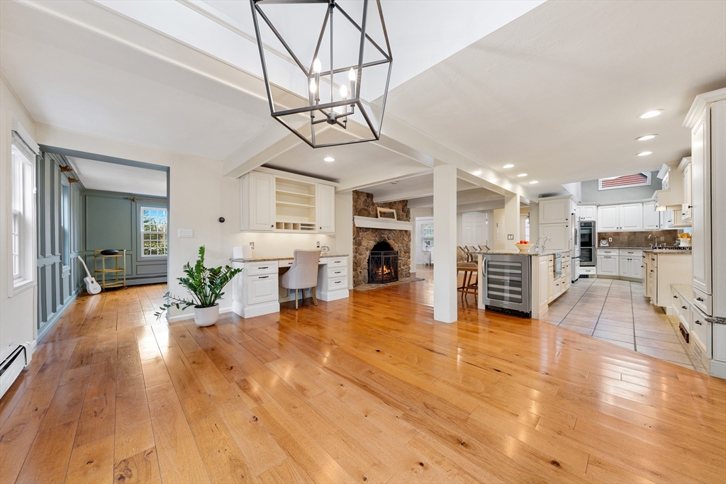63 Farm Hill Road North Attleboro, MA 02760 - Photo 15 of 42 a view of a living room and kitchen with flat screen tv