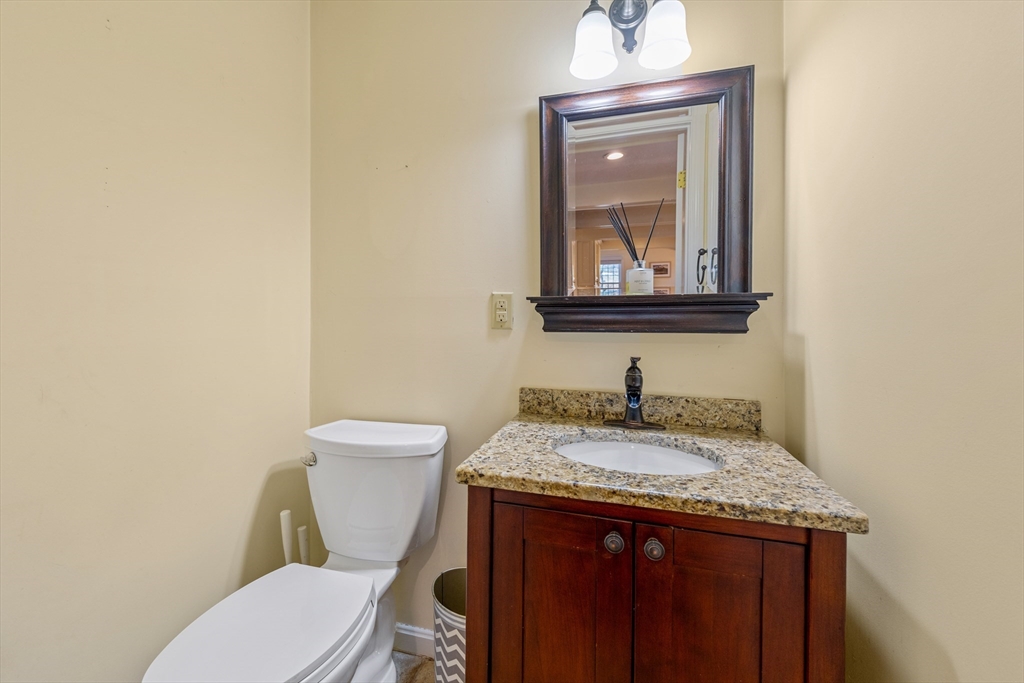 63 Farm Hill Road North Attleboro, MA 02760 - Photo 21 of 42 a bathroom with a granite countertop toilet sink and mirror