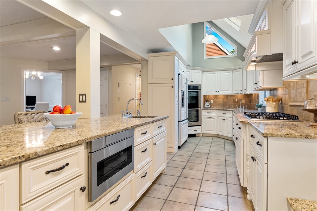 63 Farm Hill Road North Attleboro, MA 02760 - Photo 6 of 42 a kitchen with stainless steel appliances granite countertop a sink and cabinets