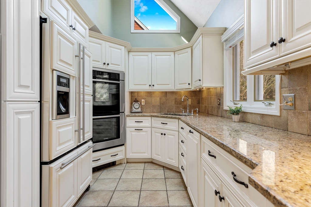 63 Farm Hill Road North Attleboro, MA 02760 - Photo 8 of 42 a kitchen with stainless steel appliances granite countertop white cabinets and white appliances