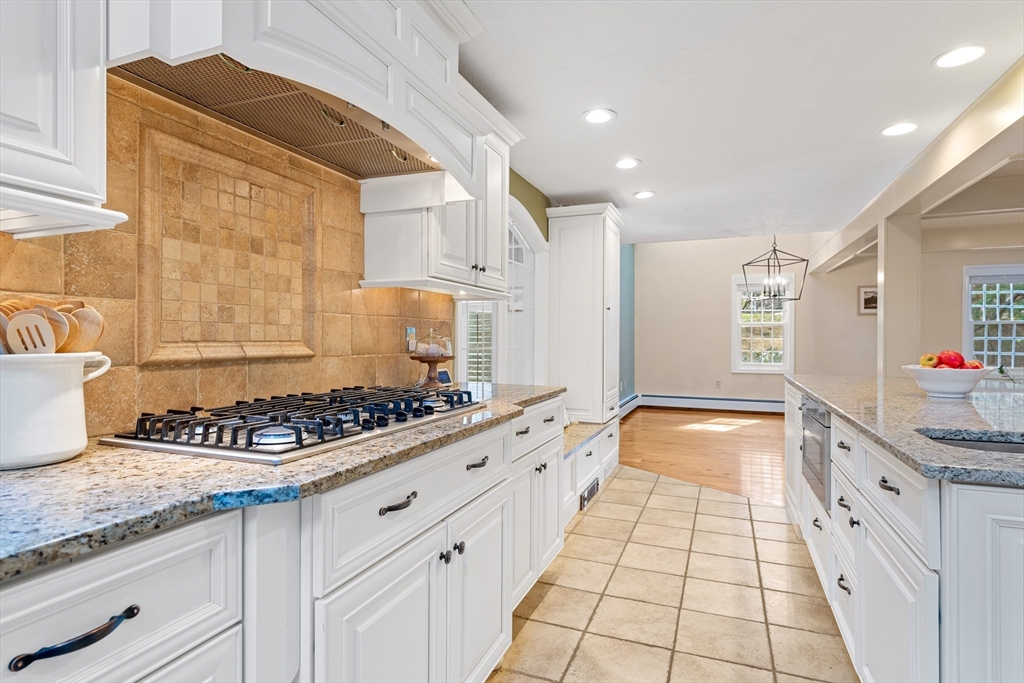 63 Farm Hill Road North Attleboro, MA 02760 - Photo 9 of 42 a large kitchen with granite countertop a sink and a stove