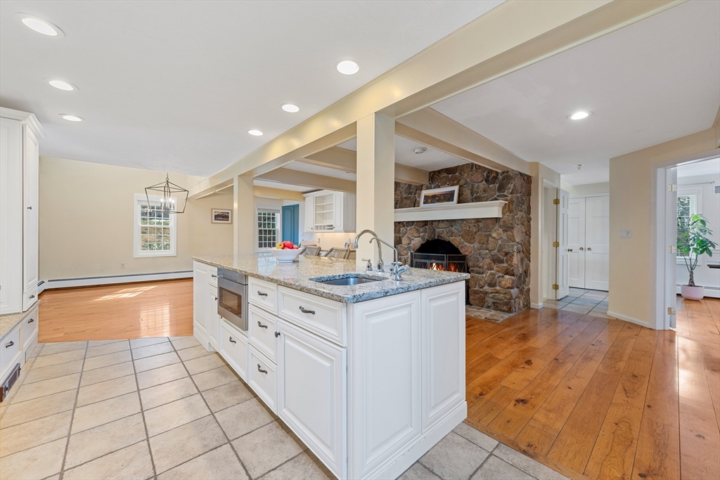 63 Farm Hill Road North Attleboro, MA 02760 - Photo 10 of 42 a kitchen with granite countertop a stove and a sink