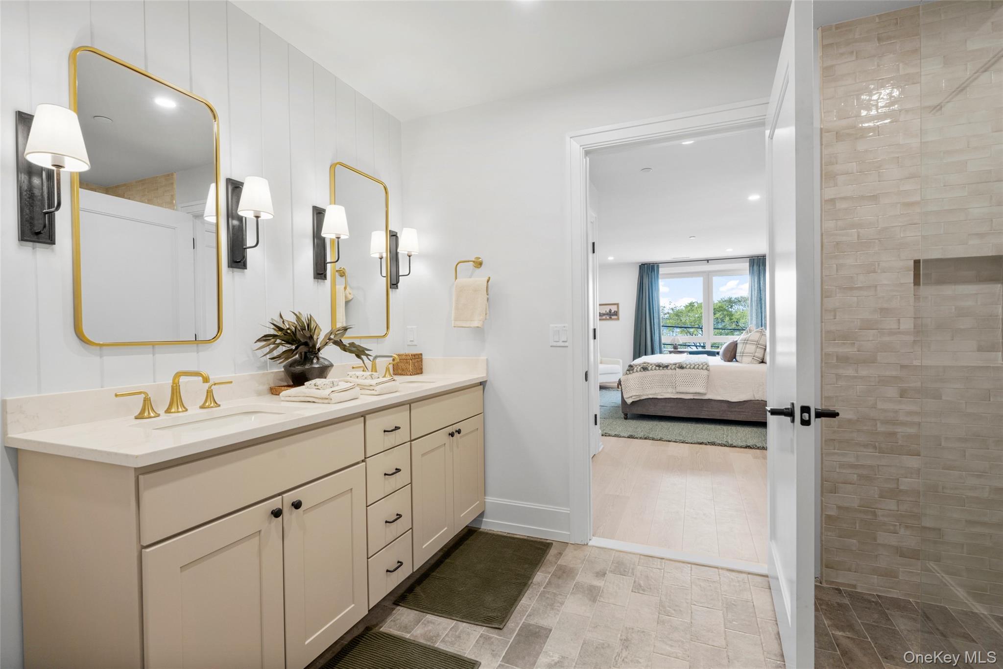 25 North Riverside Avenue, Unit 211 Croton-on-Hudson, NY 10520 - Photo 16 of 27 a en suite bathroom with a toilet sink and mirror