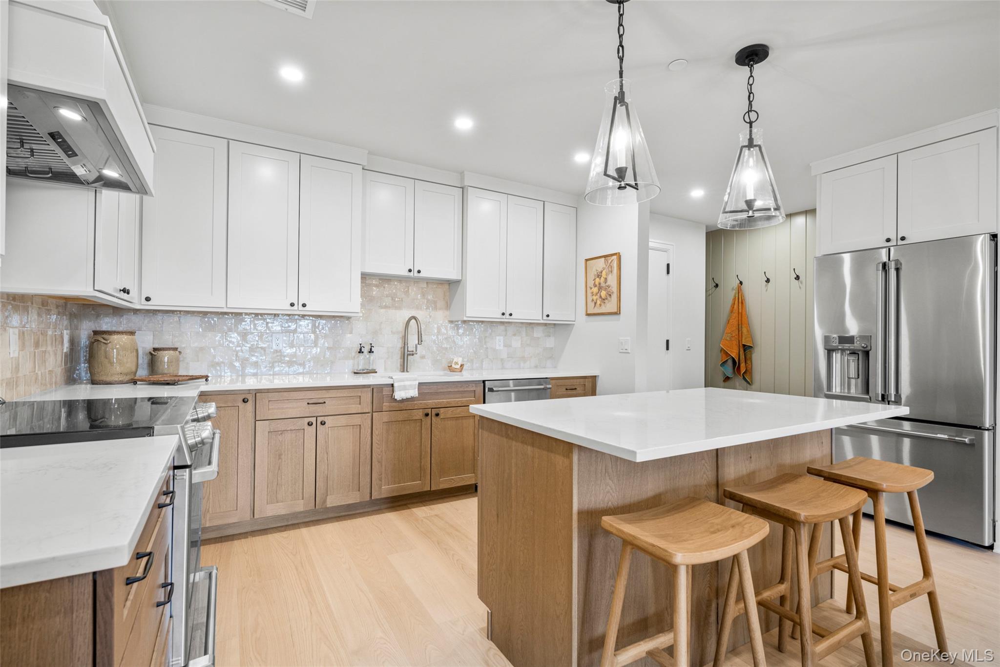 25 North Riverside Avenue, Unit 211 Croton-on-Hudson, NY 10520 - Photo 7 of 27 a kitchen with stainless steel appliances granite countertop a sink a stove a refrigerator and white cabinets