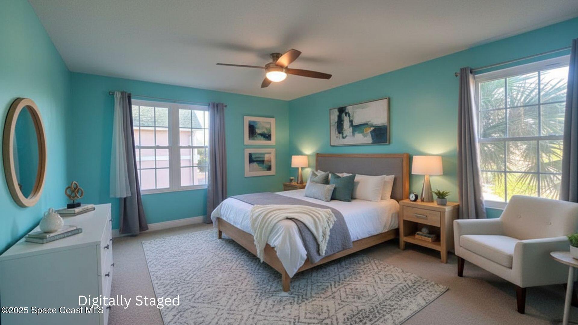 7667 North Wickham Road, Unit 522 Melbourne, FL 32940 - Photo 21 of 29 a spacious bedroom with a bed a couch and a window