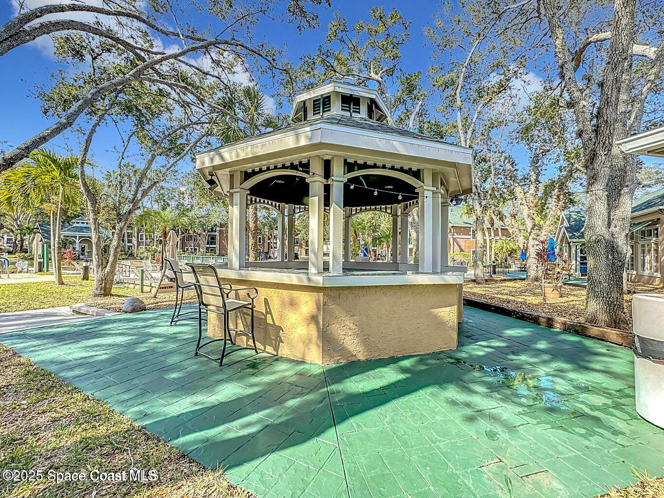 7667 North Wickham Road, Unit 522 Melbourne, FL 32940 - Photo 25 of 29 a view of a house with a yard