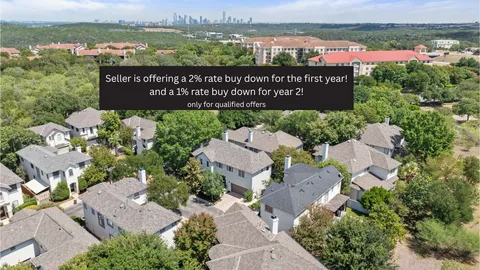 a brick house with trees in front of it