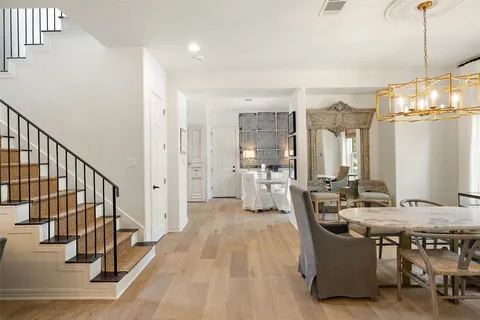 a bathroom with a tub a double vanity sink and mirror