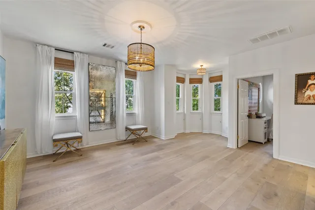 a view of a patio with table and chairs under an umbrella
