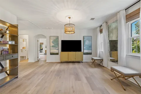 a outdoor living room with furniture and wooden floor