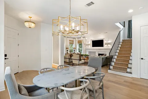 a bathroom with a tub a double vanity sink and mirror