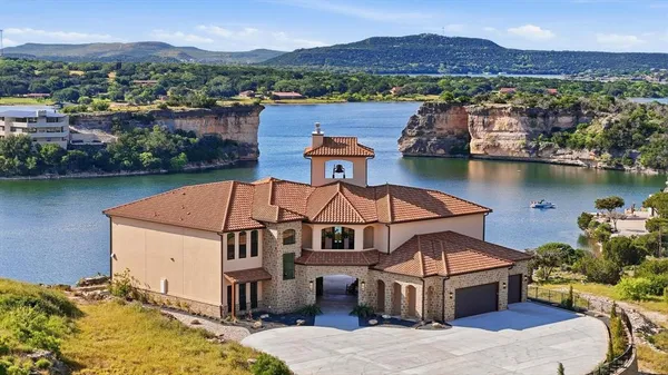 an aerial view of a house with a lake view