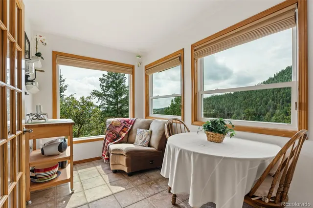 a living room with patio furniture and a window