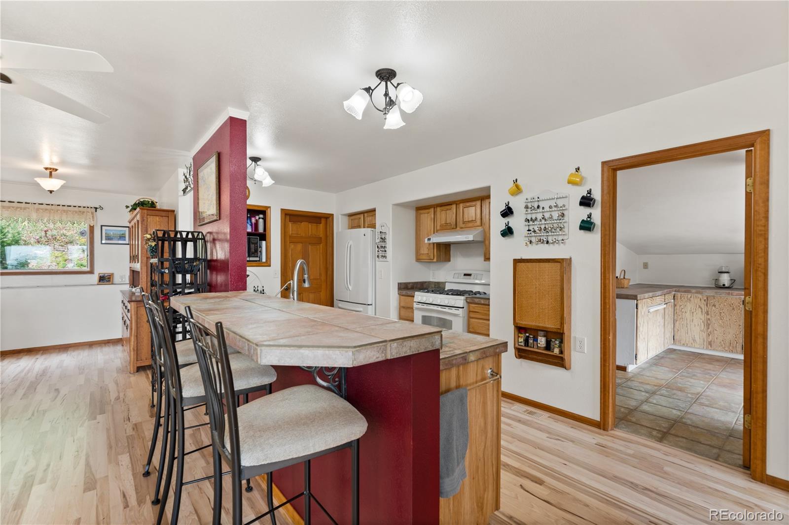 64 Highland Road Palmer Lake, CO 80133 - Photo 7 of 17 a view of a dining room with furniture and wooden floor